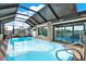 Relax in your own private, screened-in pool, which is fully enclosed and complemented by decorative stonework accents at 7305 Jasmine Blvd, Port Richey, FL 34668