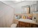 Full bathroom with sink and vanity, toilet, and shower with curtain at 7415 Ingleside Dr, Port Richey, FL 34668