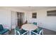Indoor/outdoor room with white walls, tile floor, and dining furniture at 7415 Ingleside Dr, Port Richey, FL 34668