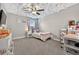 Unique bedroom features a ceiling that looks like clouds and a ceiling fan at 7570 Sweeter Tide Trl, Wesley Chapel, FL 33545