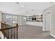 Spacious bonus room with built-in bookcases, offering ample space for entertainment, relaxation, and personalized decor at 7570 Sweeter Tide Trl, Wesley Chapel, FL 33545