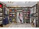 Custom walk-in closet with ample storage space and shelving for shoes and clothing at 7570 Sweeter Tide Trl, Wesley Chapel, FL 33545