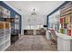 Versatile craft room with built-in desks, shelving, and ample storage for creative projects at 7570 Sweeter Tide Trl, Wesley Chapel, FL 33545
