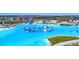 Gorgeous lagoon featuring clear turquoise waters, waterslides, and recreational activities for all ages at 7570 Sweeter Tide Trl, Wesley Chapel, FL 33545