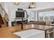 Inviting living room features shiplap accent wall, fireplace, and comfortable seating creating a cozy atmosphere at 7570 Sweeter Tide Trl, Wesley Chapel, FL 33545