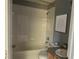 Full bathroom with shower and tub combination, tile backsplash, and a single vanity at 7705 Nottinghill Sky Dr, Apollo Beach, FL 33572
