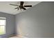 Bedroom featuring neutral walls, carpeted floors, and ceiling fan at 7705 Nottinghill Sky Dr, Apollo Beach, FL 33572