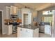 Modern kitchen with stainless steel appliances and granite countertops at 7705 Nottinghill Sky Dr, Apollo Beach, FL 33572