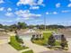 Aerial view of a well maintained one story home with lush landscaping, nestled in a manicured neighborhood at 8174 Wheat Stone Dr, Zephyrhills, FL 33540