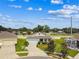 Aerial view of a well maintained one story home with lush landscaping, nestled in a manicured neighborhood at 8174 Wheat Stone Dr, Zephyrhills, FL 33540