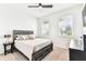 Bedroom with ceiling fan, carpeted floor, and bright natural light at 8174 Wheat Stone Dr, Zephyrhills, FL 33540