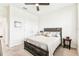 Bedroom with ceiling fan, carpeted floor, and bright natural light at 8174 Wheat Stone Dr, Zephyrhills, FL 33540