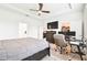 Bedroom featuring a bed, workspace, closet, carpet, and ceiling fan at 8174 Wheat Stone Dr, Zephyrhills, FL 33540