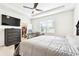 Bedroom with a bed, workspace, closet, ceiling fan and carpet at 8174 Wheat Stone Dr, Zephyrhills, FL 33540