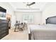 Bright bedroom with a ceiling fan, work space, closet, and carpet at 8174 Wheat Stone Dr, Zephyrhills, FL 33540
