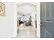 View through the arched entryway to a spacious living area, showcasing an open-concept design at 8174 Wheat Stone Dr, Zephyrhills, FL 33540