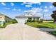 Well maintained single Gathering home with a two car garage, landscaped yard, and paved driveway at 8174 Wheat Stone Dr, Zephyrhills, FL 33540