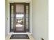 A welcoming front door with glass panels and a 