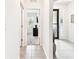 Bright hallway offering entry view and open access to bedroom at 8174 Wheat Stone Dr, Zephyrhills, FL 33540