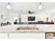 Close-up of kitchen island featuring granite countertops and stainless steel sink, blending into the living space at 8174 Wheat Stone Dr, Zephyrhills, FL 33540
