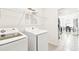 Clean laundry room with washer, dryer, and overhead shelving at 8174 Wheat Stone Dr, Zephyrhills, FL 33540