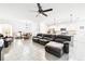 Spacious living room and open layout, connecting to the kitchen and dining area at 8174 Wheat Stone Dr, Zephyrhills, FL 33540