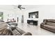 Comfortable living room showcasing leather furniture, modern decor, and neutral color palette at 8174 Wheat Stone Dr, Zephyrhills, FL 33540