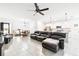 Spacious living room and open layout, connecting to the kitchen and dining area at 8174 Wheat Stone Dr, Zephyrhills, FL 33540