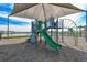 Neighborhood playground with slide and climbing structure covered with a protective shade to keep cool at 8174 Wheat Stone Dr, Zephyrhills, FL 33540