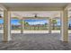 Relaxing community pool area with shaded pavilion, tables, and seating for outdoor enjoyment at 8174 Wheat Stone Dr, Zephyrhills, FL 33540