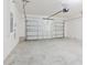 Clean and spacious two car garage with an electric opener, offering ample room for parking and storage at 8210 Juning Cv, Wesley Chapel, FL 33545