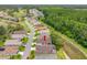Aerial view of a residential neighborhood with houses next to a conservation area at 9751 Conservation Dr, New Port Richey, FL 34655