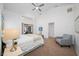 This bedroom features an ensuite bathroom, a ceiling fan and lots of light at 9751 Conservation Dr, New Port Richey, FL 34655