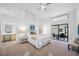 A bright bedroom with a sliding glass door and an ensuite bathroom at 9751 Conservation Dr, New Port Richey, FL 34655