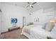 Relaxing bedroom featuring neutral tones, plush bedding and a bench at 9751 Conservation Dr, New Port Richey, FL 34655