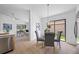 Breakfast nook with backyard view and open layout to the living area at 9751 Conservation Dr, New Port Richey, FL 34655
