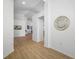 Bright, open foyer with hardwood floors and a view into the home's living spaces at 9751 Conservation Dr, New Port Richey, FL 34655
