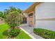 Welcoming front entrance featuring double doors and manicured bushes at 9751 Conservation Dr, New Port Richey, FL 34655