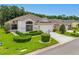 Beautiful single-story home featuring well-maintained landscaping and a spacious driveway leading to a two-car garage at 9751 Conservation Dr, New Port Richey, FL 34655