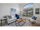 Bright living room with large window, comfortable seating, and stylish decor at 9751 Conservation Dr, New Port Richey, FL 34655