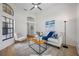 Open living room featuring high ceilings, a ceiling fan, and comfortable seating at 9751 Conservation Dr, New Port Richey, FL 34655