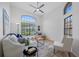 Comfortable living room featuring high ceilings, lots of natural light, and neutral decor at 9751 Conservation Dr, New Port Richey, FL 34655