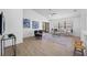 Open living room featuring a ceiling fan and views to the backyard at 9751 Conservation Dr, New Port Richey, FL 34655