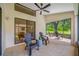 Spacious screened patio with tile flooring and comfortable seating furniture at 9751 Conservation Dr, New Port Richey, FL 34655