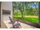 Inviting screened patio offers serene outdoor views and comfortable seating at 9751 Conservation Dr, New Port Richey, FL 34655