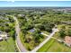 Aerial view of a neighborhood with lush greenery and waterfront at 9903 Saddle Rd, Tampa, FL 33626
