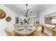 Bright dining room with modern chandelier and seating for four at 9903 Saddle Rd, Tampa, FL 33626