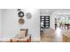 Bright foyer featuring modern double doors, stylish decor, and wood-look tile flooring at 9903 Saddle Rd, Tampa, FL 33626