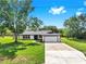Well-maintained home with a large front yard and driveway at 9903 Saddle Rd, Tampa, FL 33626