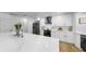 Kitchen boasting stainless steel appliances, a large island, and white cabinetry at 9903 Saddle Rd, Tampa, FL 33626